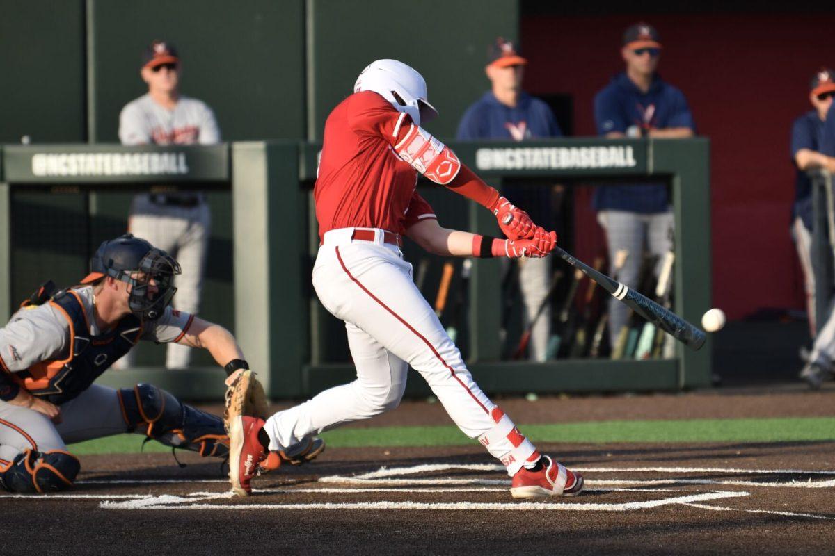 Sophomore catcher Alex Sosa hits during the Wolfpack's home game against the Virginia Cavaliers on Doak Field at Dail Park on Friday, April 4, 2025. Sosa had one hit for one run and one runner batted in. The Cavaliers beat the Wolfpack 8-6 to take the first game of the series.
