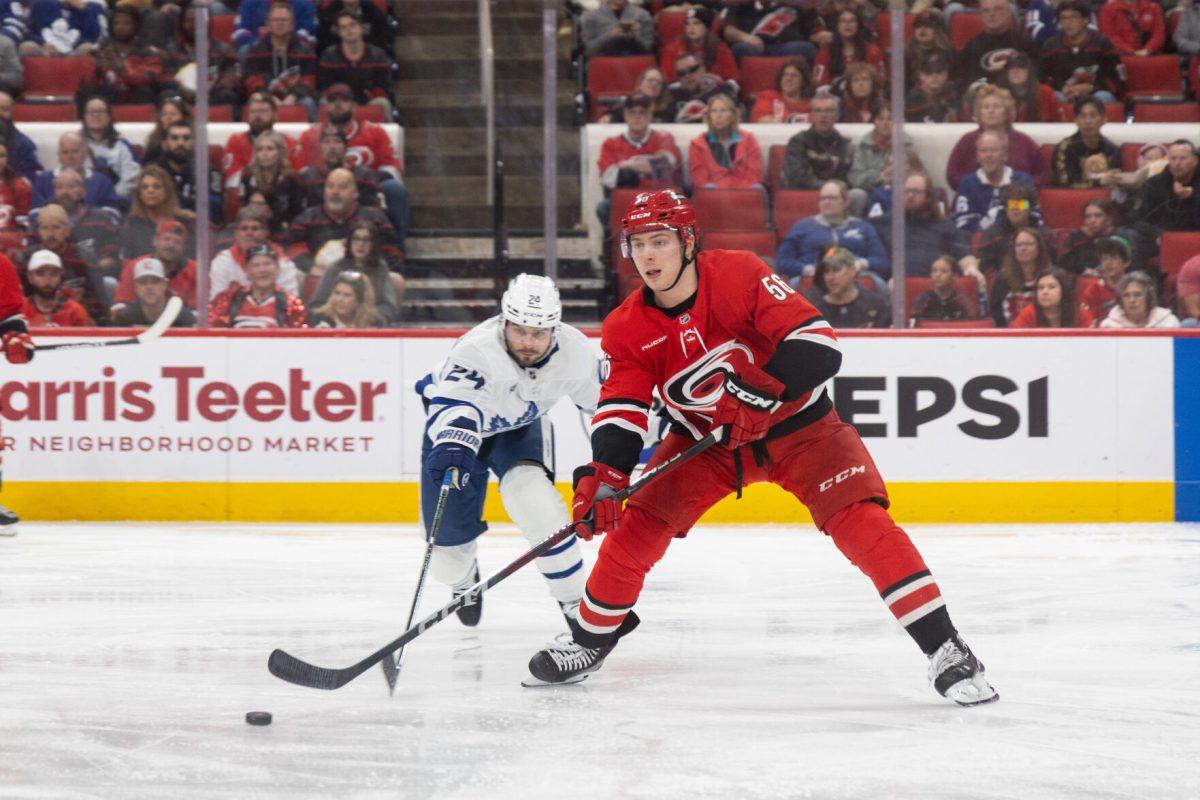 Defenseman Scott Morrow passes the puck during the game versus the Toronto Maple Leafs at the Lenovo Center on Sunday, April 13, 2025. The Hurricanes lost to the Maple Leafs 4-1.