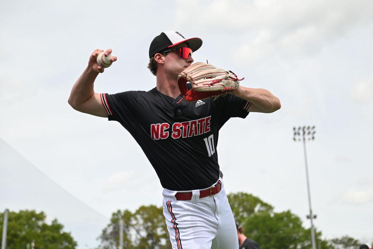 Sophomore infielder Ryan Jaros throws during warmups before the game against Virginia on April 6, 2025 at Doak Field at Dail Park. Jaros had two at bats as a pinch hitter in the final innings of the game. NC State beat Virginia 9-8.