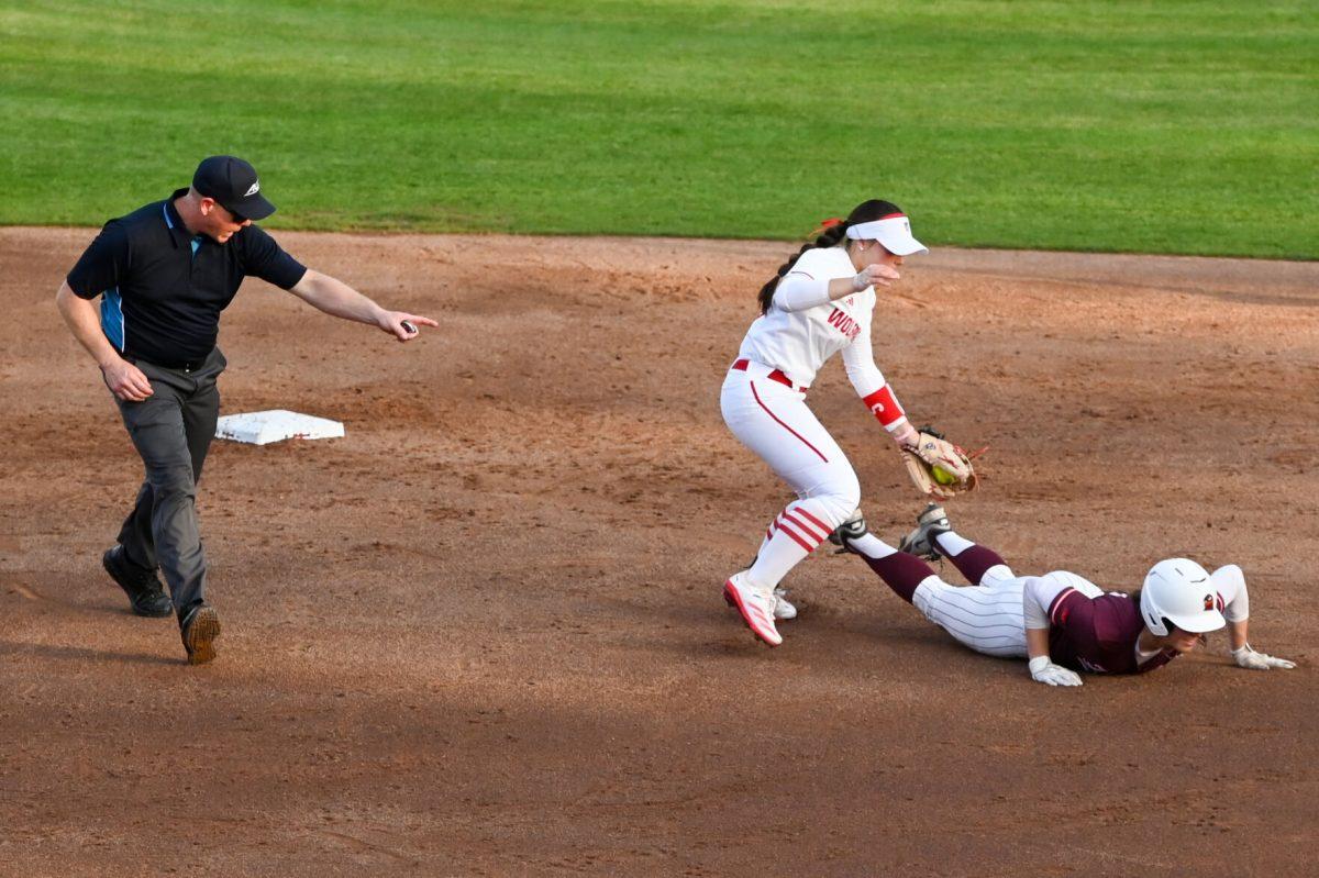Freshman infielder Kendall Simmers reaches out to tag an opponent out during the game against Virginia Tech at Dail Softball Stadium on Friday, April 5, 2025. Simmers hit a homreun. NC State lost the game 10-2.