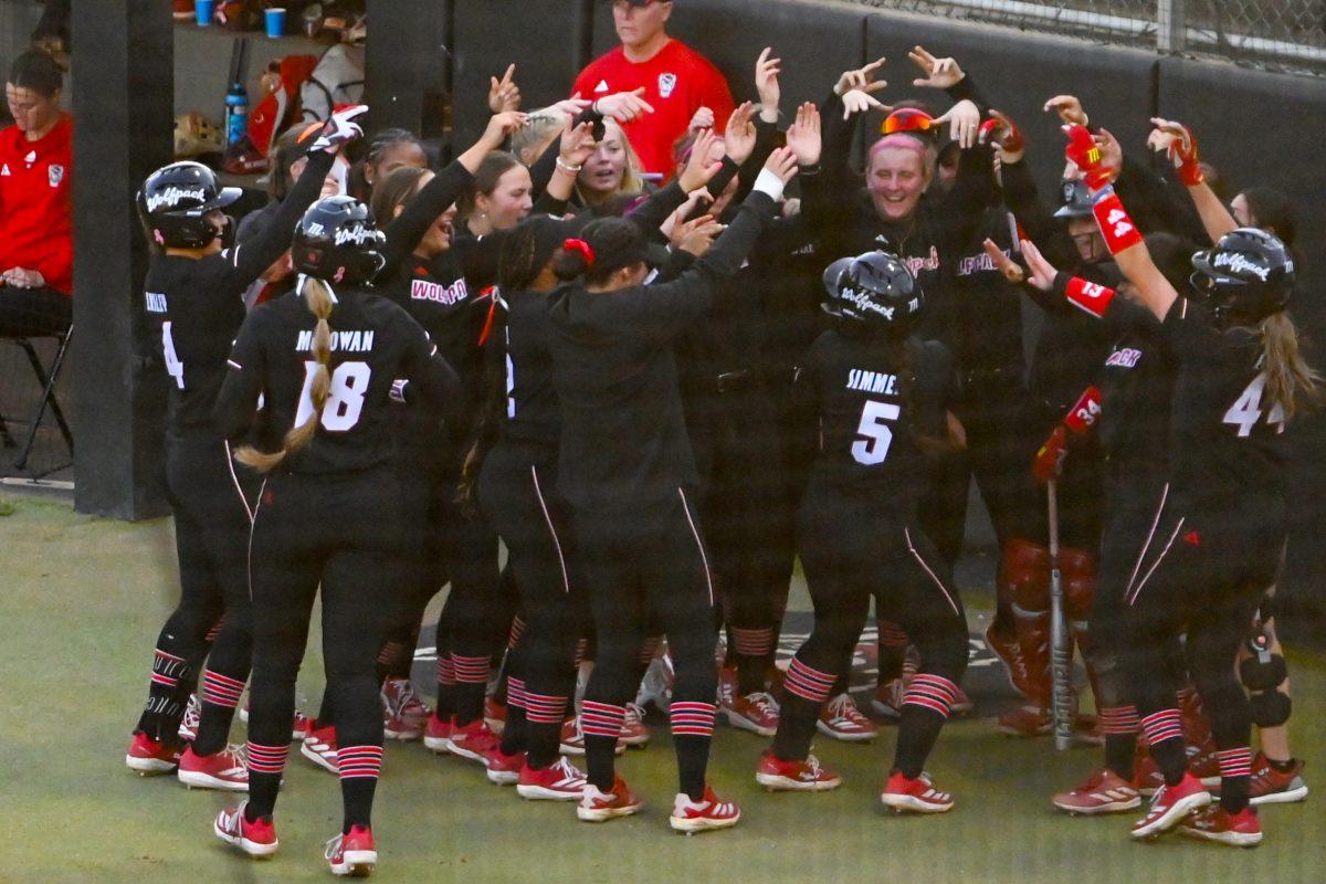 Freshman infielder Kendall Simmers celebrates with her team after hitting a home run during the second game of the doubleheader against Longwood at Dail Softball Stadium on Tuesday, April 15, 2025. NC State won the game 7-0. Simmers tallied three runs batted in.