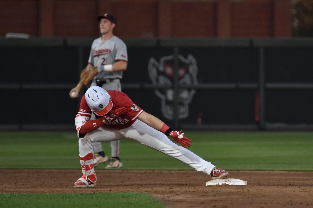 Sophomore catcher Alex Sosa hits for a double and celebrates at second base during the Wolfpack's home game against the Virginia Cavaliers on Doak Field at Dail Park on Friday, April 4, 2025. Sosa had one hit for one run and one runner batted in. The Cavaliers beat the Wolfpack 8-6 to take the first game of the series.