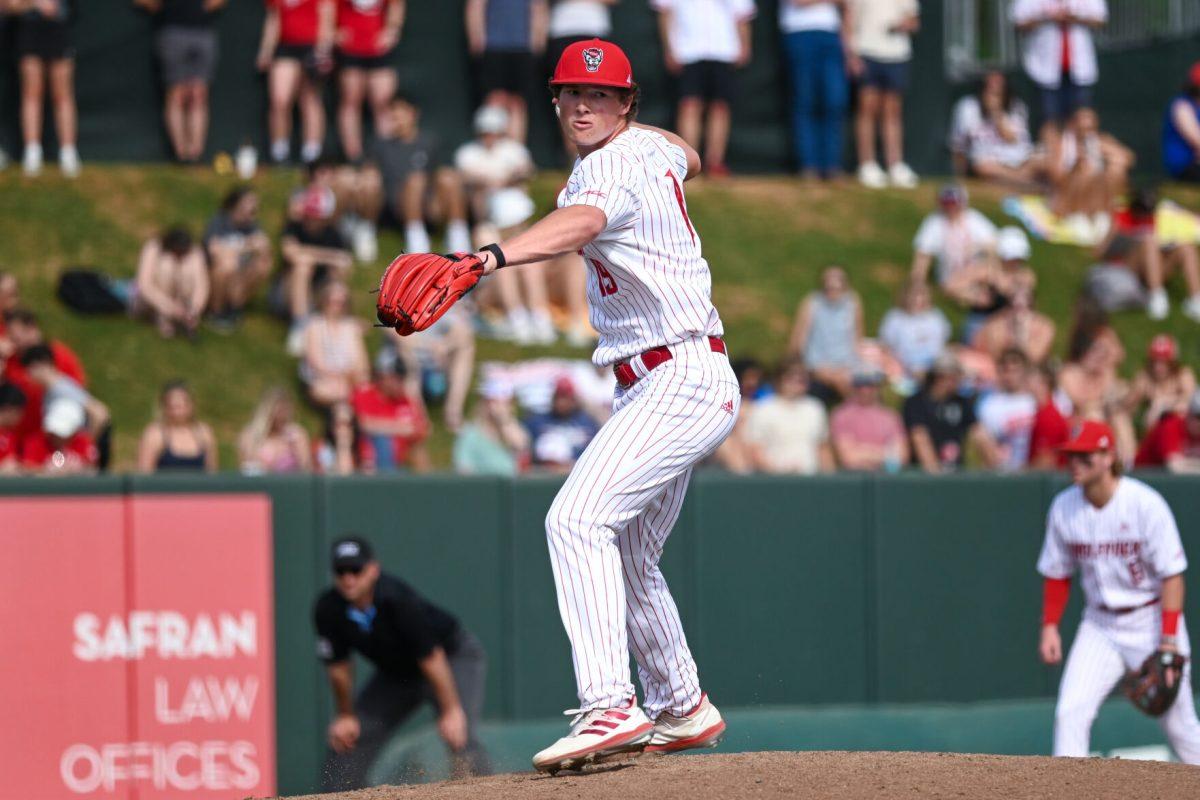 Sophomore right handed pitcher Heath Andrews pickes off to first base during the game against Virginia on April 5, 2025 at Doak Field at Dail Park. Andrews had four strikeouts through six innings while only giving up three hits. NC State beat Virginia 9-2.