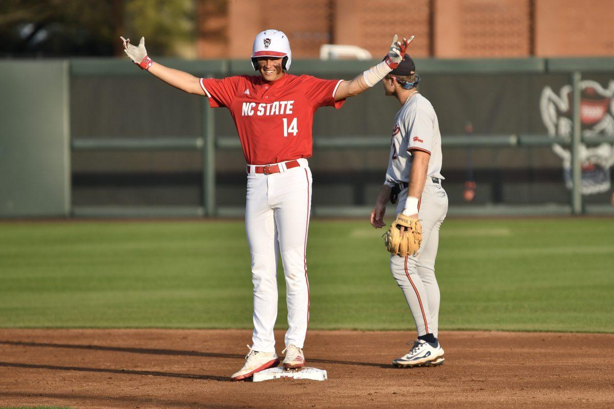 Freshman outfielder Ty Head celebrates making it to second base during the Wolfpack's home game against the Virginia Cavaliers on Doak Field at Dail Park on Friday, April 4, 2025. Head stole a home run on defense and went two for two before being walked the rest of the game from the batter's box. The Cavaliers beat the Wolfpack 8-6 to take the first game of the series.