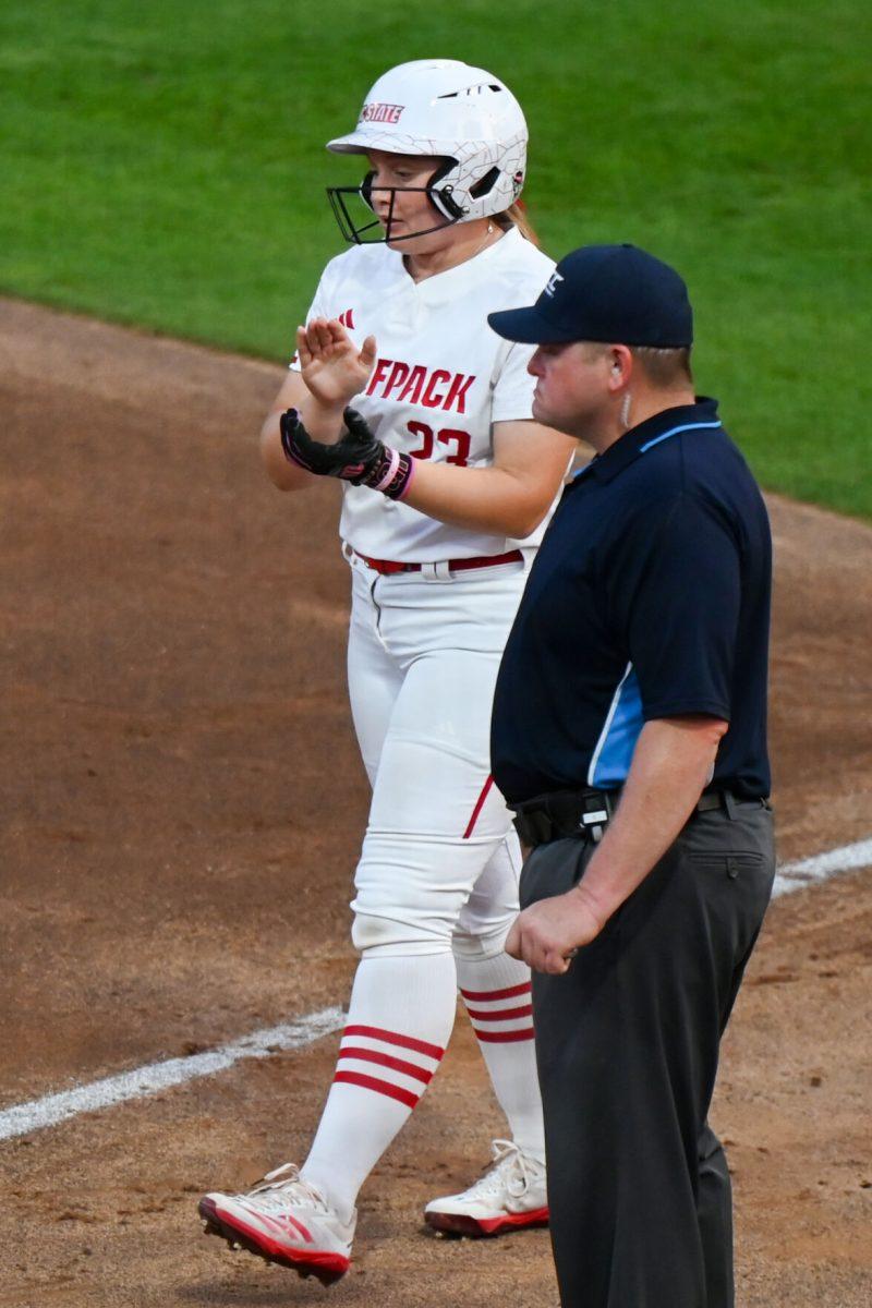 Junior catcher Hannah Church claps during the game against Virginia Tech at Dail Softball Stadium on Friday, April 5, 2025. Church had one hit during her two times at bat. NC State lost the game 10-2.
