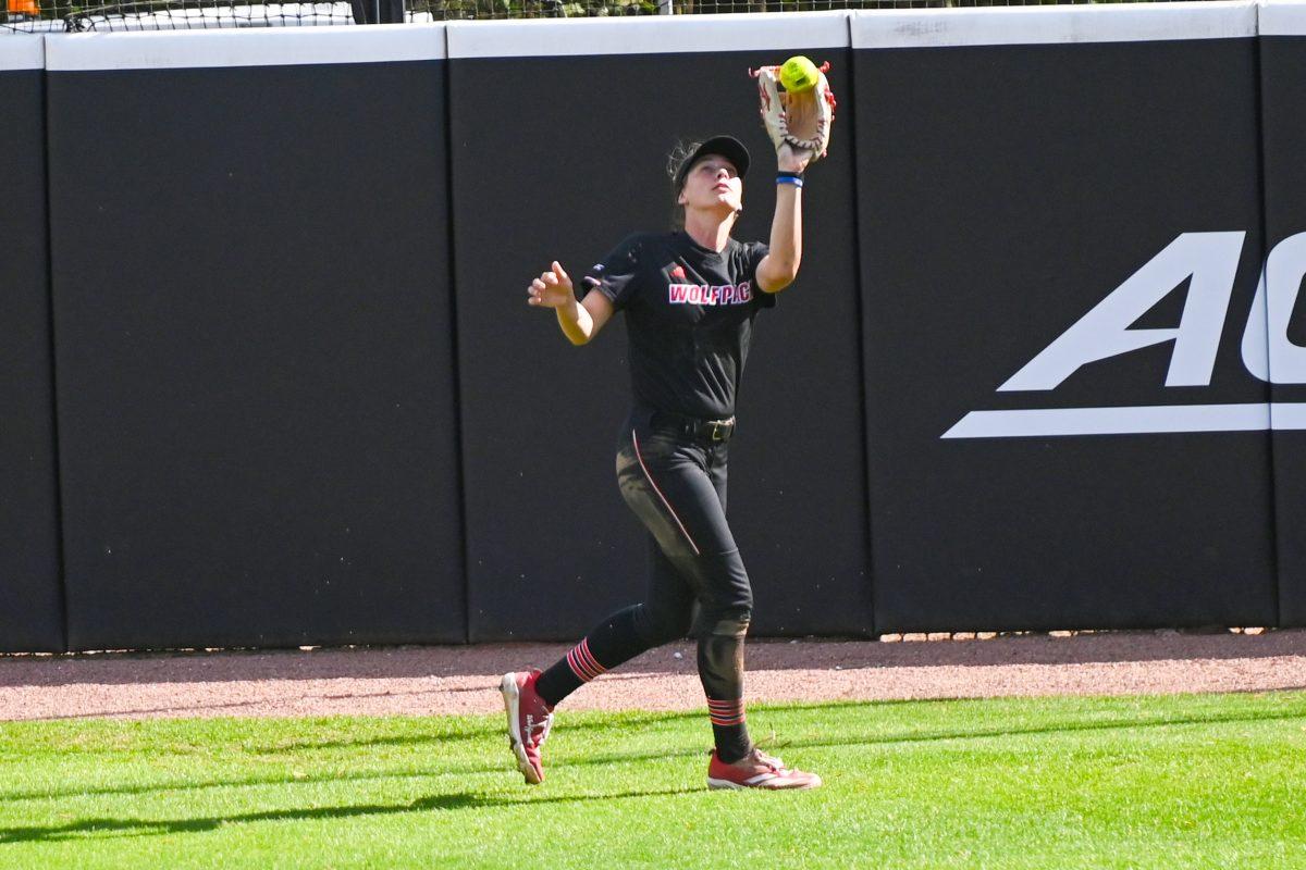Senior outfielder Taylor Ensley catches a fly ball in the outfield during the first game of the doubleheader against Longwood at Dail Softball Stadium on Tuesday, April 15, 2025. NC State lost the game 1-0.