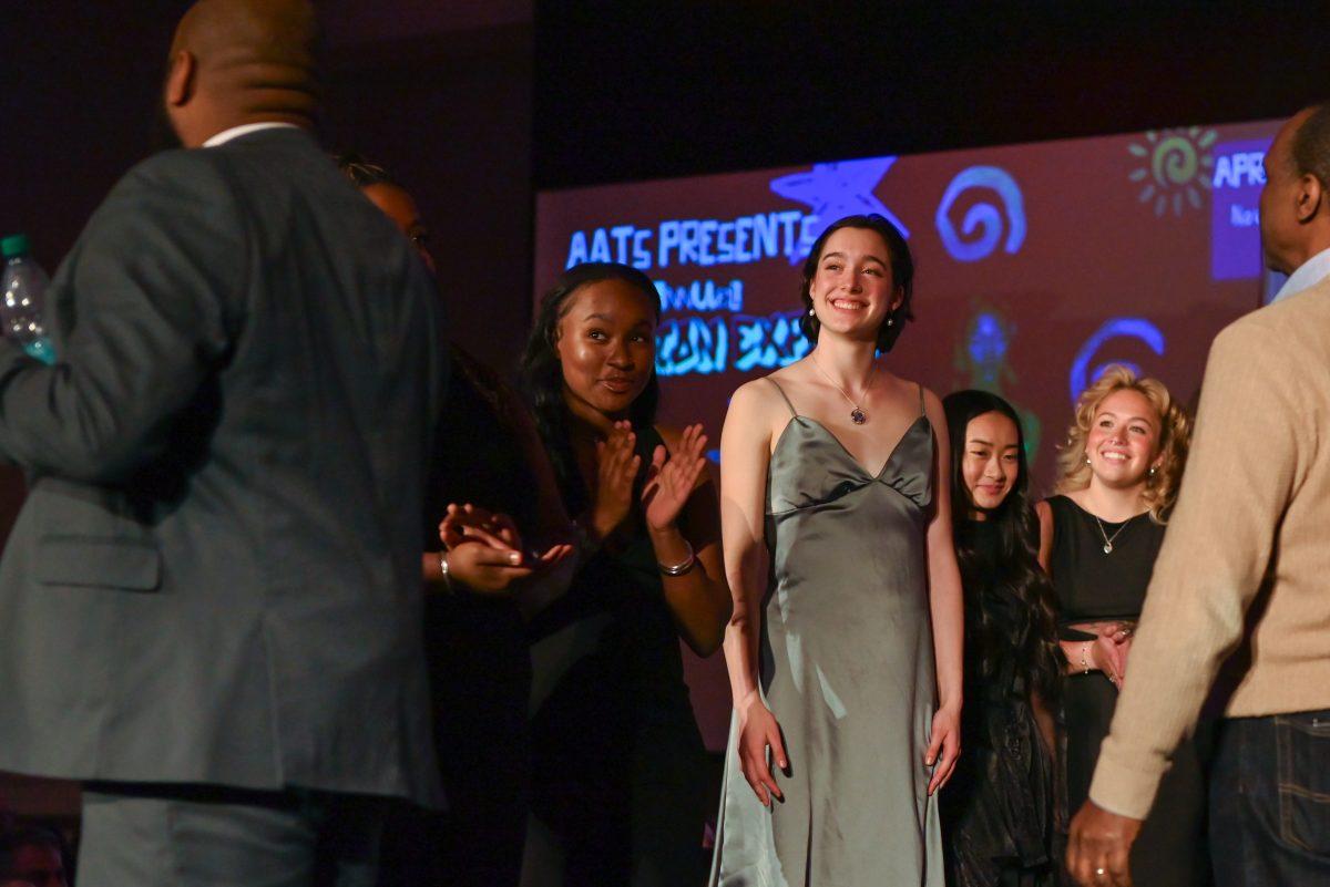 Brianna Anderson, a second-year studying fashion and textile design, smiles after being named third runner up in the novice category during the 27th Annual Fashion Expose at Talley Student Union on Thursday, April 10, 2025. Designers were sorted and judged in two categories: novice and intermediate and beyond.