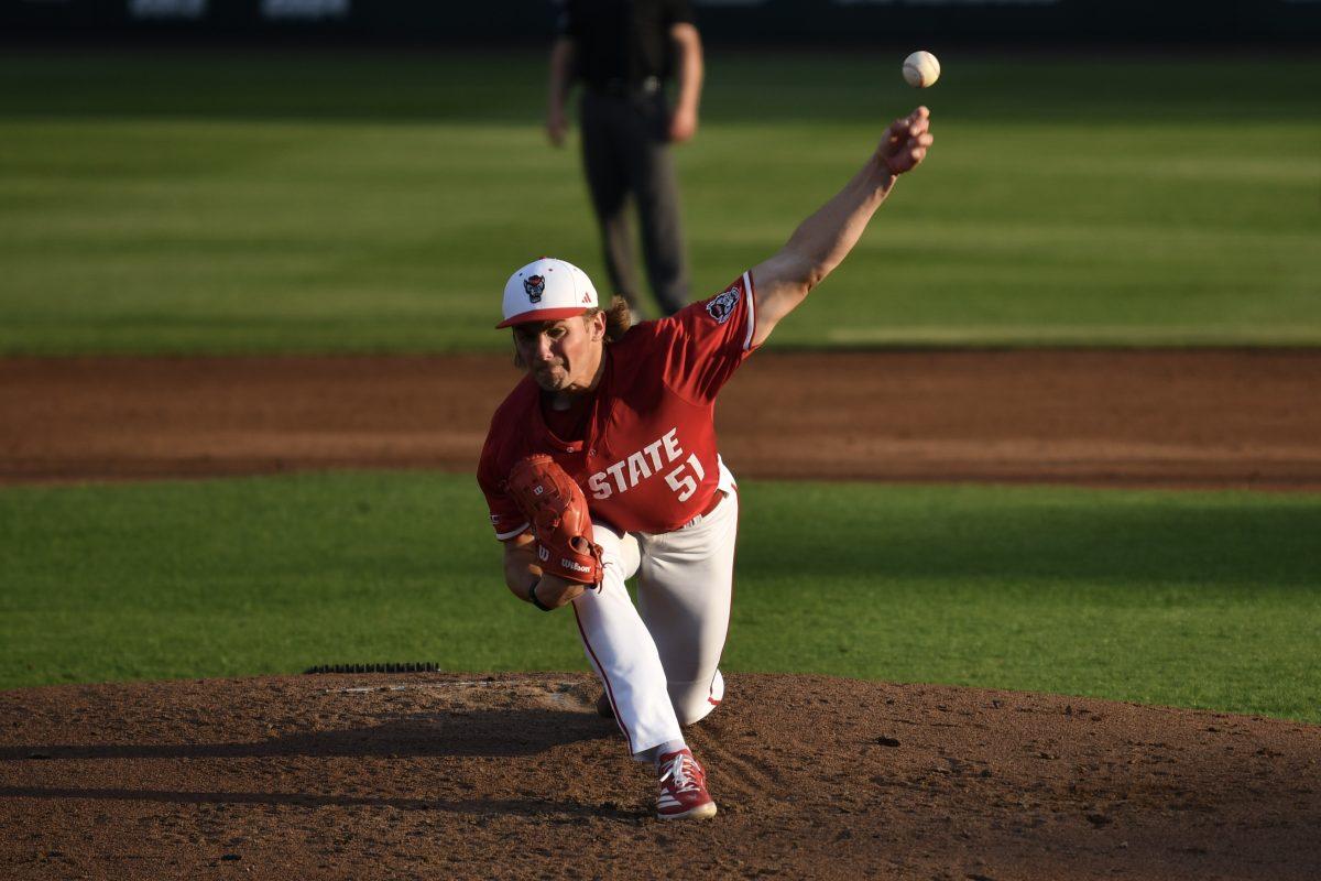 Junior starting pitcher Dominic Fritton pitches during the Wolfpack's home game against the Virginia Cavaliers on Doak Field at Dail Park on Friday, April 4, 2025. Fritton gave up one run through five innings pitched before giving up four in the sixth, including a three-run home run before being pulled. The Cavaliers beat the Wolfpack 8-6.