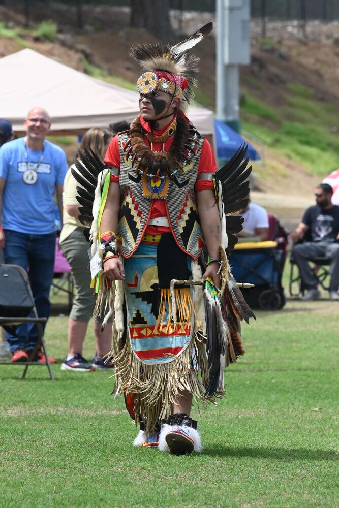 Nosa Chavis prepares himself for another dance competition during NC State's 35th Annual Powwow at Miller Fields on Saturday, April 5, 2025. The event featured Native business vendors, traditional drum groups and performances of different Indigenous dances. Powwow originated as an opportunity for tribal nations to unite and celebrate their respective identities and cultures, and it serves the same purpose at NC State.