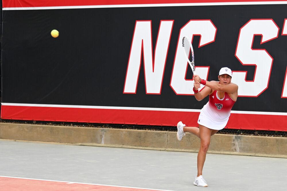 Freshman Mia Slama smacks the ball during her singles match against Georgia Tech at J.W. Isenhour Tennis Center on Sunday, March 30, 2025. Slama won her singles match 7-5, 6-2. The Wolfpack beat the Yellow Jackets 4-3.