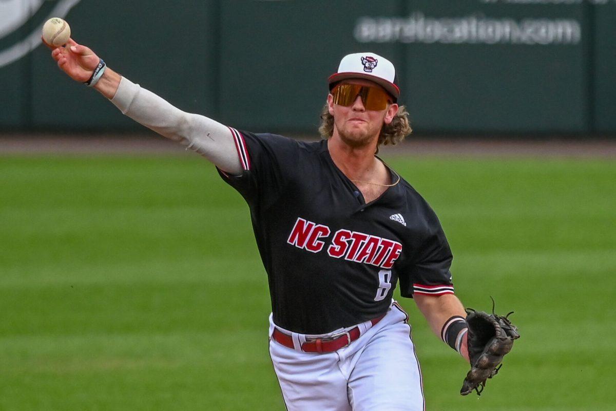 Senior infielder Justin DeCriscio throws the ball to first during the game against Virginia on April 6, 2025 at Doak Field at Dail Park. DeCriscio had a home run during his three at bats. NC State beat Virginia 9-8.