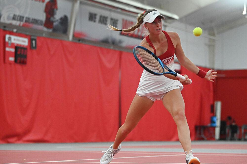Freshman Gabia Paskauskas moves in to hit the ball at the net during the match against Campbell at the J.W. Isenhour Tennis Center on Friday, Jan. 17, 2025. Paskauskas won her singles match 6-0, 6-0. NC State beat Campbell 7-0.