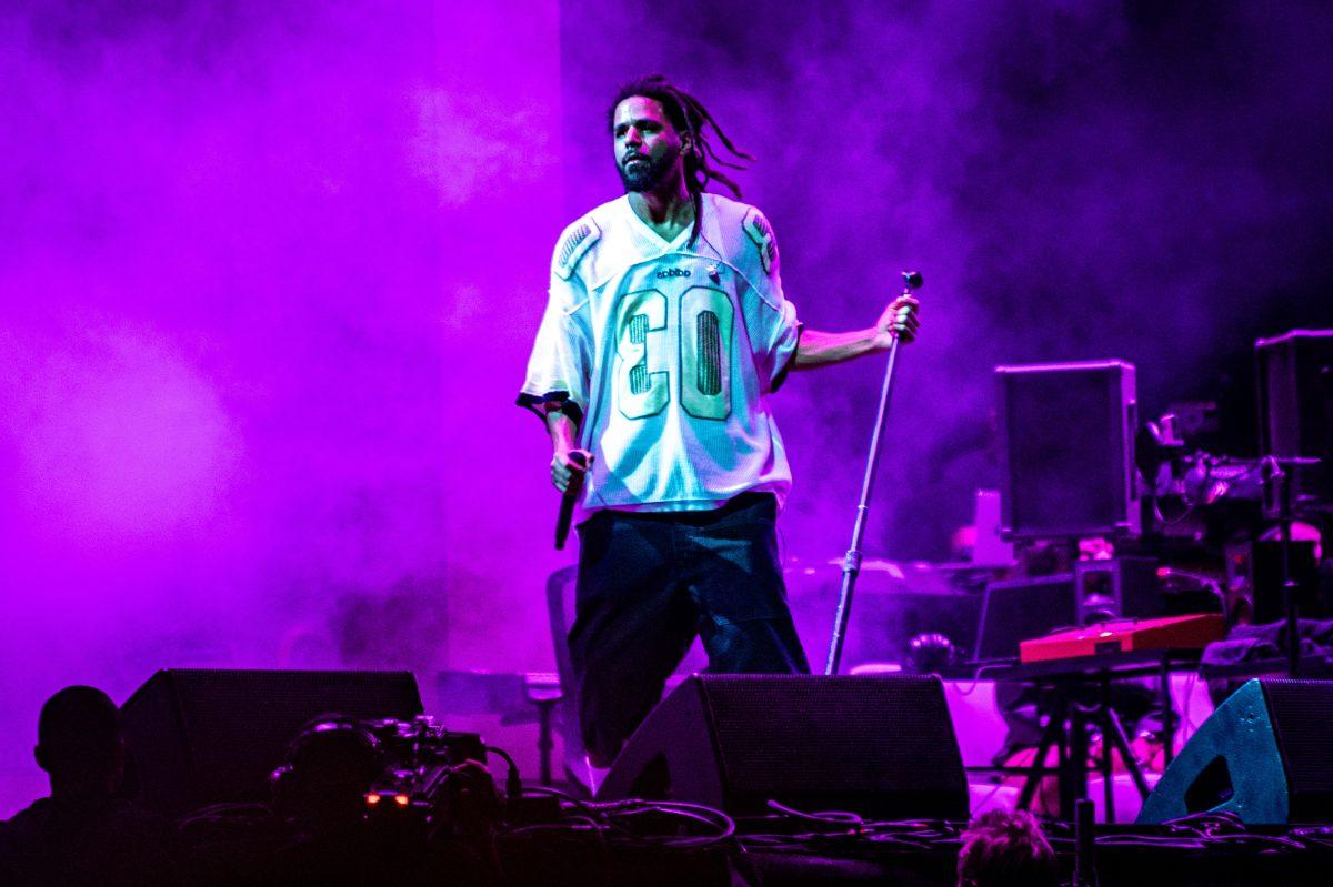 J. Cole holds the microphone stand while performing during the final Dreamville Festival in Dorothea Dix Park on April 6, 2025. Cole headlined the final day of the event.