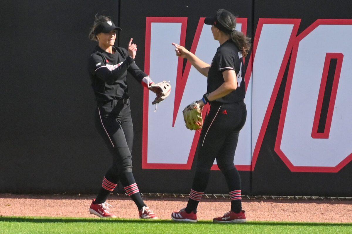 Senior outfielder Taylor Ensley and sophomore outfielder Tori Ensley point at one another during the first game of the doubleheader against Longwood at Dail Softball Stadium on Tuesday, April 15, 2025. NC State lost the game 1-0.