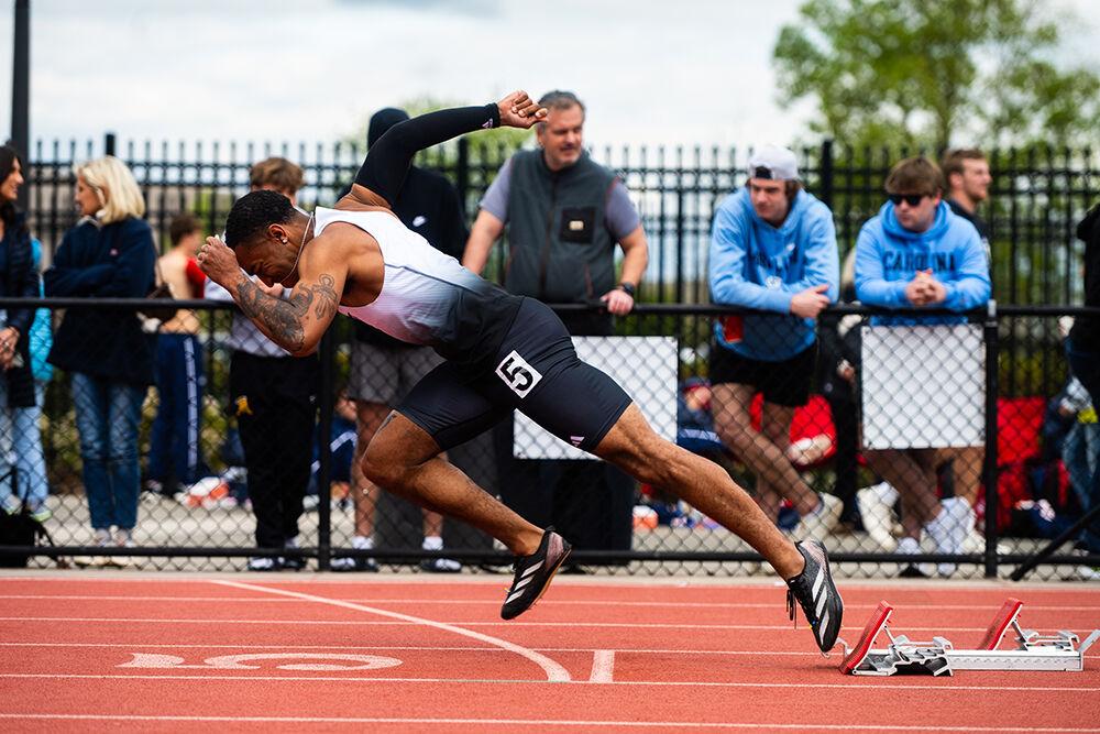 Sophomore sprinter Kyron Parker launches off from the starting block in the 200m during the Duke Invitational in the Morris Williams Stadium on Saturday, April 13, 2025. Parker placed first in his heat with a time of 21.72.