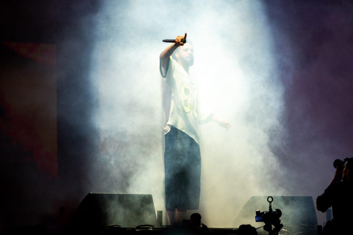 J. Cole points to the crowd while performing during the final Dreamville Festival in Dorothea Dix Park on April 6, 2025. Cole headlined the final day of the event.