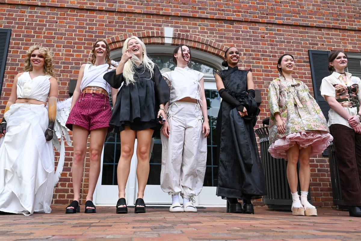 Designers and models smile after taking a bow after Art2Wear: Revive at the Gregg Museum of Art &amp; Design on Thursday, April 24, 2025. Instead of a traditional fashion runway, Art2Wear displayed the wearable artwork through performance art done by the artists and models.