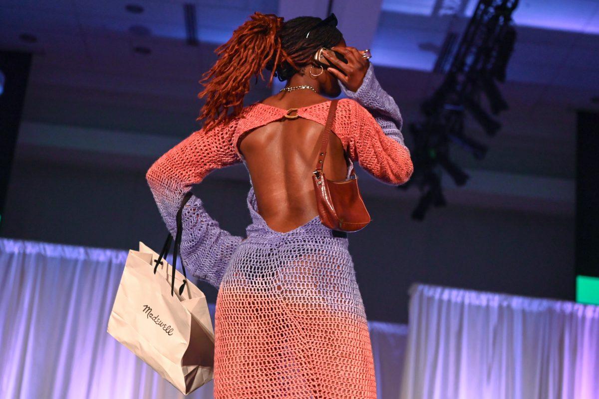 A model turns around to show the back of her dress designed by Layla Nichols as part of her collection, "Classically Refreshed," during the 27th Annual Fashion Expose at Talley Student Union on Thursday, April 10, 2025. Nichols was one of the winners in the novice designer category.