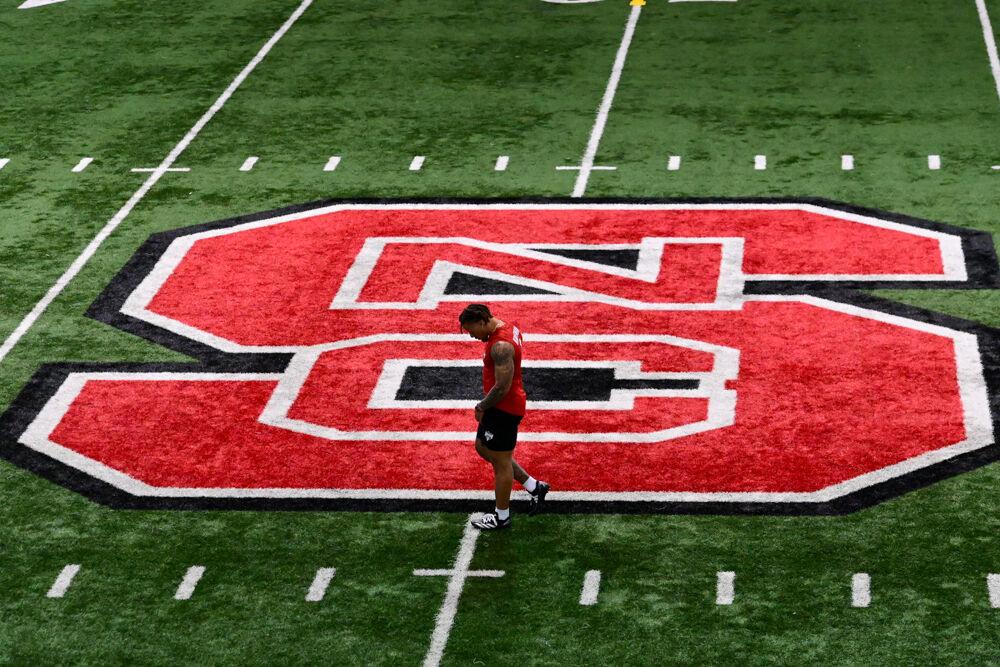 Senior safety DK Kaufman walks in the middle of the field during NC State football's Pro Day in the Close-King Indoor Practice Facility on Tuesday, March 25, 2025. NC State players performed a variety of tasks in front of NFL scouts before the upcoming draft.