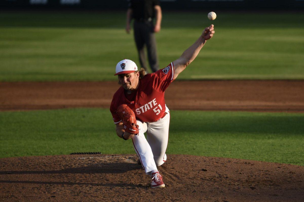 Junior starting pitcher Dominic Fritton pitches during the Wolfpack's home game against the Virginia Cavaliers on Doak Field at Dail Park on Friday, April 4, 2025. Fritton gave up one run through five innings pitched before giving up four in the sixth, including a three-run home run before being pulled. The Cavaliers beat the Wolfpack 8-6.