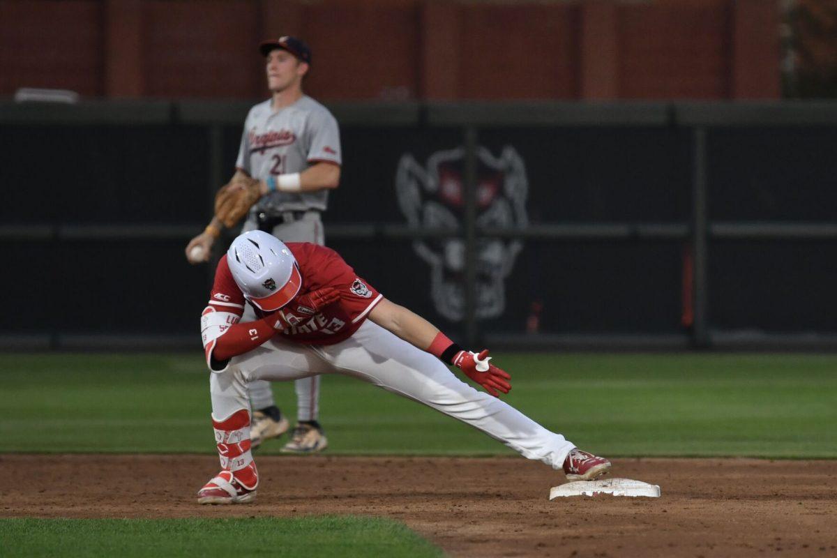 Sophomore catcher Alex Sosa hits for a double and celebrates at second base during the Wolfpack's home game against the Virginia Cavaliers on Doak Field at Dail Park on Friday, April 4, 2025. Sosa had one hit for one run and one runner batted in. The Cavaliers beat the Wolfpack 8-6 to take the first game of the series.