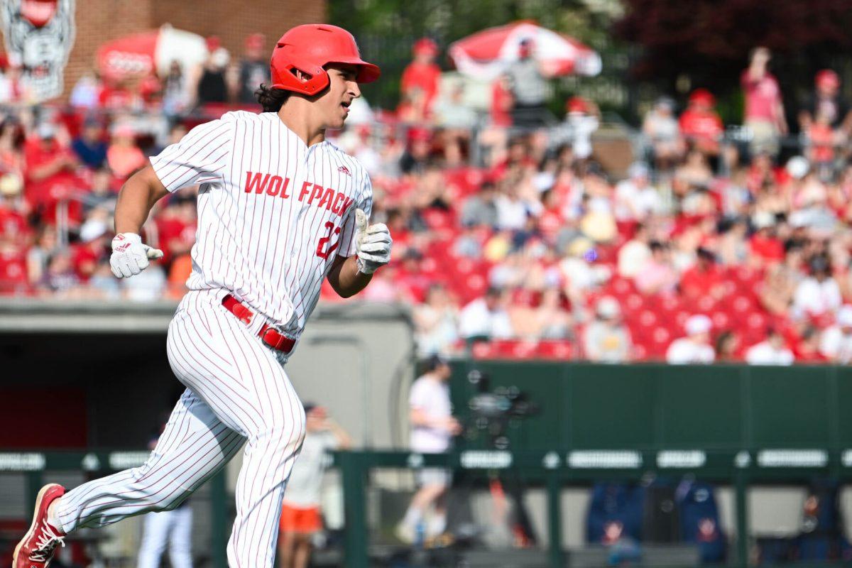 Sophomore infielder Chris McHugh rounds first base during the game against Virginia at Doak Field at Dail Park on Saturday, April 5, 2025. The Wolfpack beat the Cavaliers 9-2.
