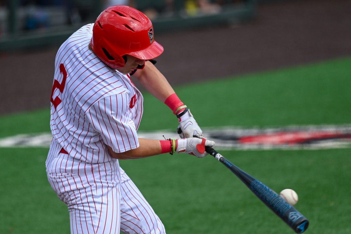 Junior outfielder Brayden Fraasman hits the ball during the game against Virginia on April 5, 2025 at Doak Field at Dail Park. Fraasman had two hits and one run. NC State bested Virginia 9-2.