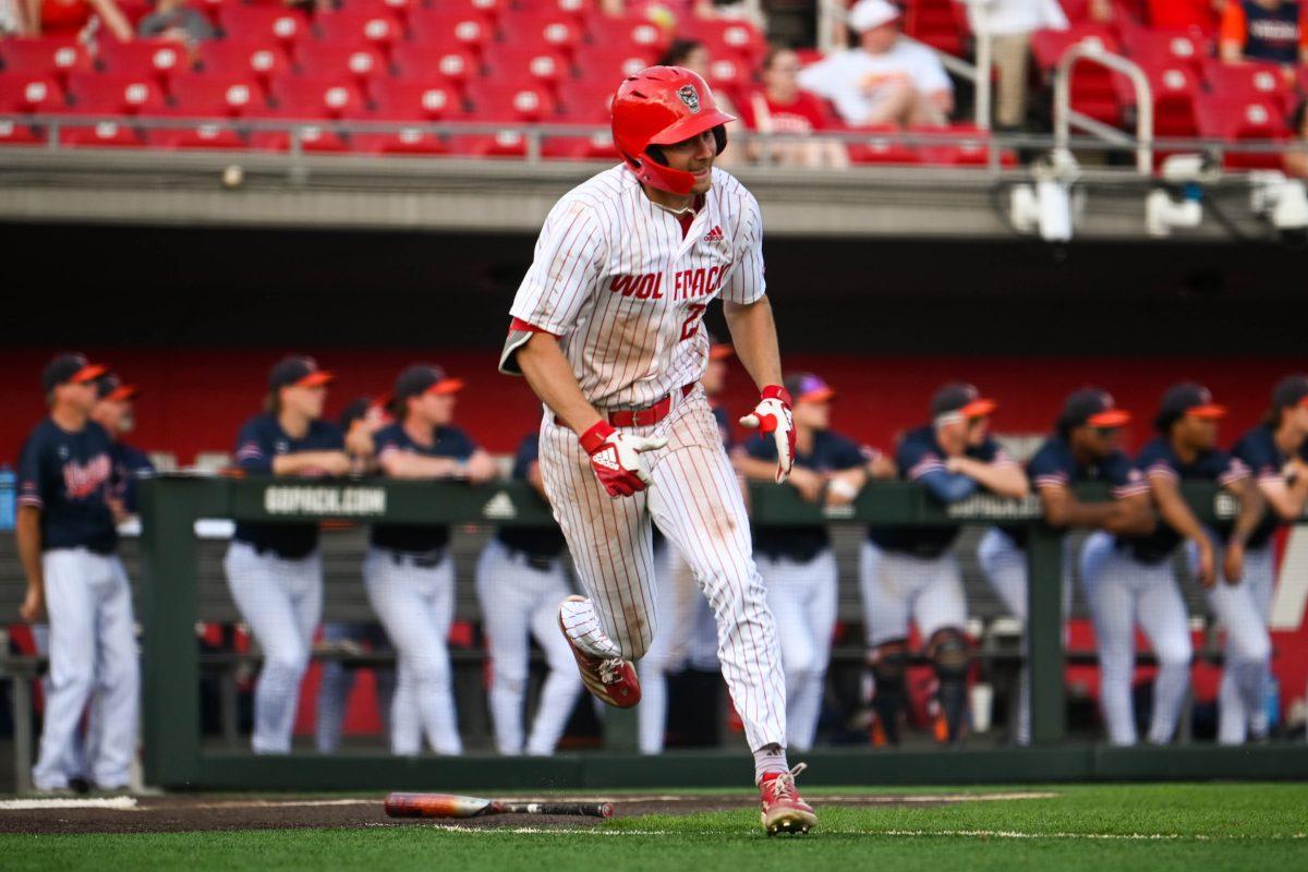 Junior outfielder Josh Hogue runs down to first base during the game against Virginia at Doak Field at Dail Park on Saturday, April 5, 2025. The Wolfpack beat the Cavaliers 9-2.