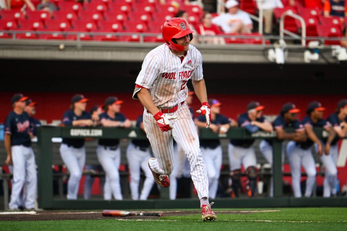 Junior outfielder Josh Hogue runs down to first base during the game against Virginia at Doak Field at Dail Park on Saturday, April 5, 2025. The Wolfpack beat the Cavaliers 9-2.