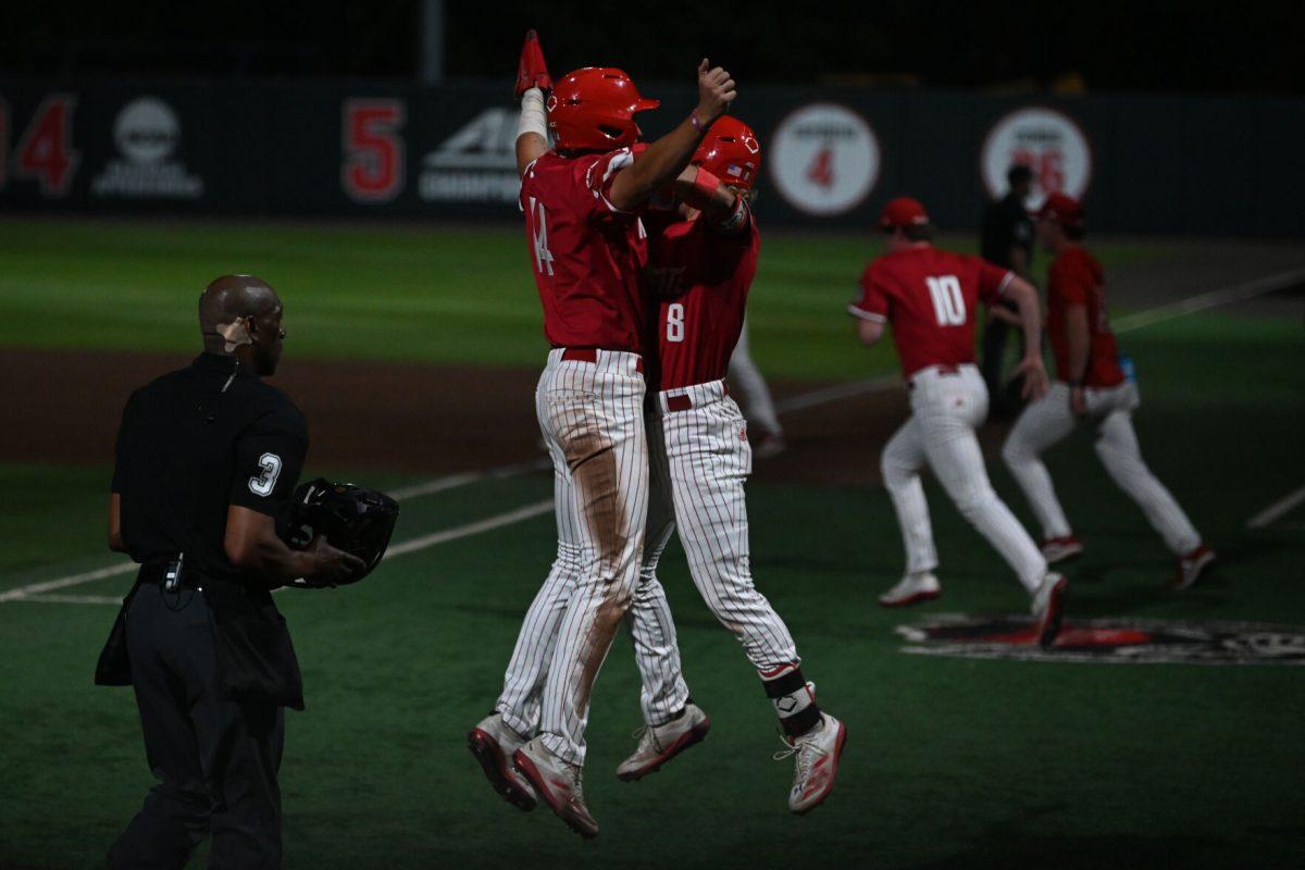 Freshman outfielder Ty Head chest bumps senior infielder Justin DeCriscio after the Wolfpack recorded a run rule RBI to end the game in the eighth inning over the Clemson Tigers on Doak Field at Dail Park on Thursday, April 24, 2025. The Wolfpack were lead by Junior infielder Brayden Fraasman, who tallied two home runs, a double and a single and recorded seven RBI across five at bats. The Wolfpack beat the number two ranked Tigers 14-4.
