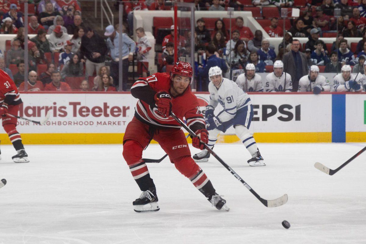Center Tyson Jost passes the puck during the game versus the Toronto Maple Leafs at the Lenovo Center on Sunday, April 13, 2025. The Hurricanes lost to the Maple Leafs 4-1.