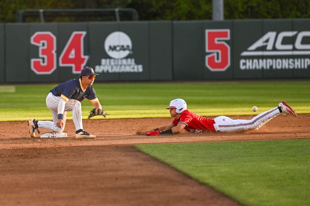 Freshman outfielder Ty Head dives to secure second base during the game against UNC-Greensboro on Doak Field at Dail Park on Tuesday, April 1, 2025. The Wolfpack defeated the Spartans 9-6.