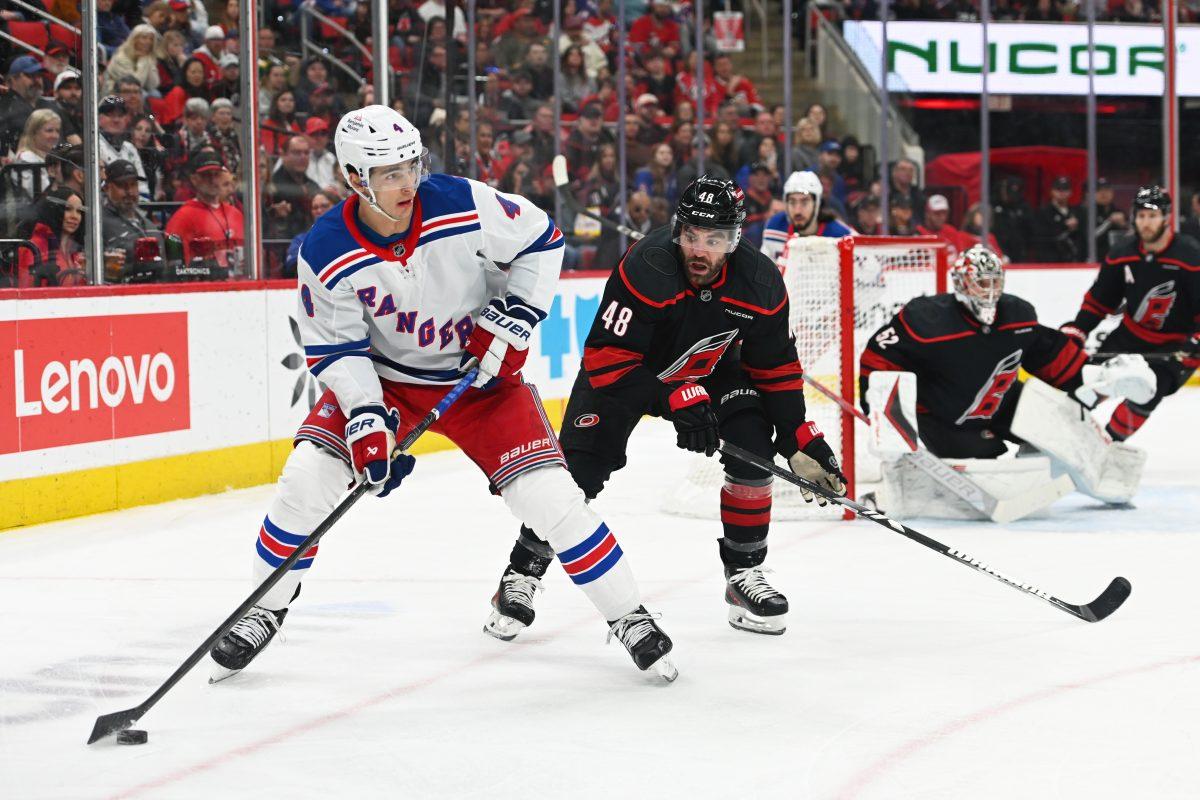 Defenseman Jordan Martinook battles an opponent for the puck during the game versus the New York Rangers at the Lenovo Center on Saturday, April 12, 2025. Martinook scored one goal for the Hurricanes. The Hurricanes beat the Rangers 7-3.