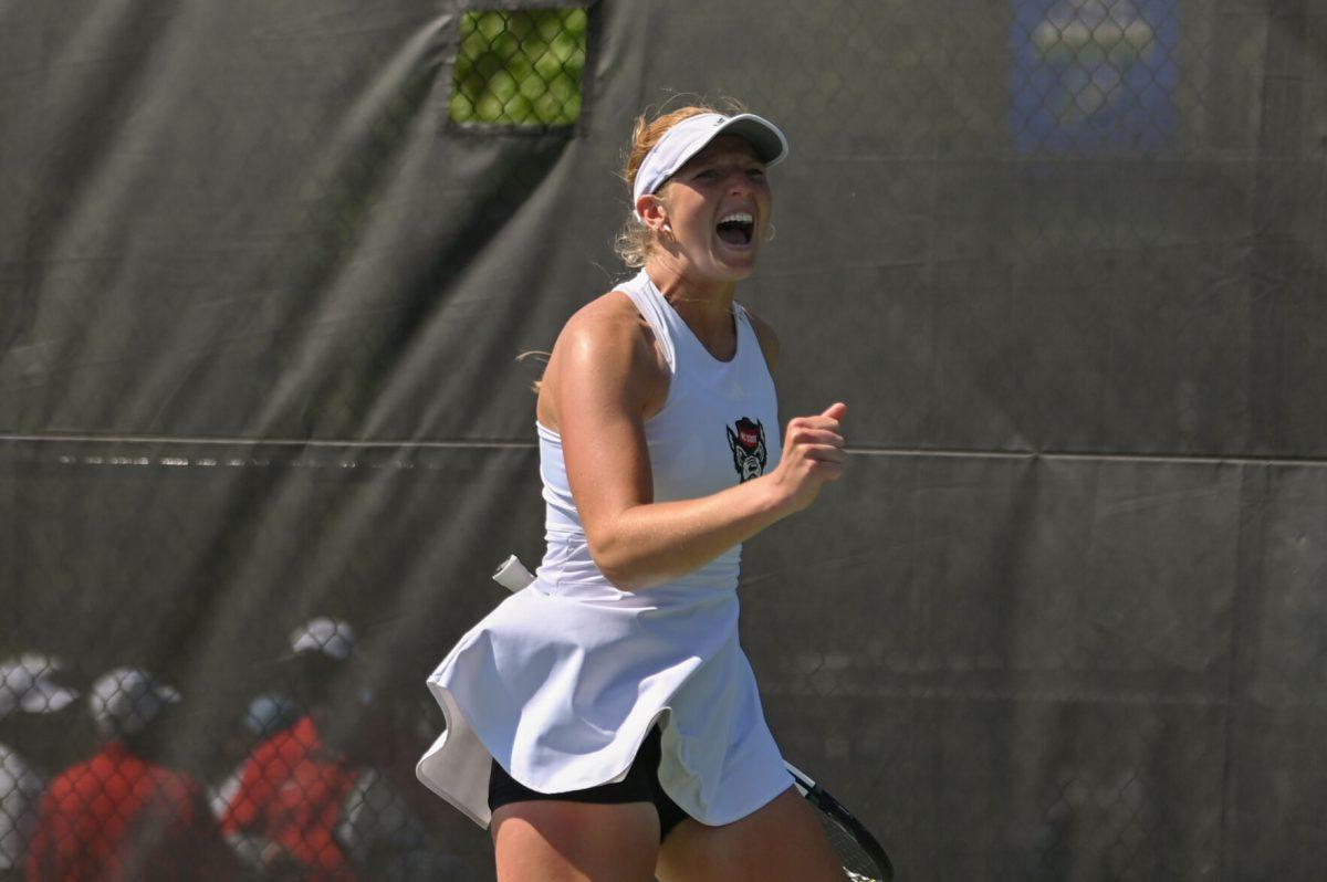 Sophomore Maddy Zampardo yells as she celebrates winning her last set after her match against Notre Dame at Cary Tennis Park on Friday, April 18, 2025. Zampardo won both her singles and doubles matches. The Wolfpack defeated the Fighting Irish 4-1.