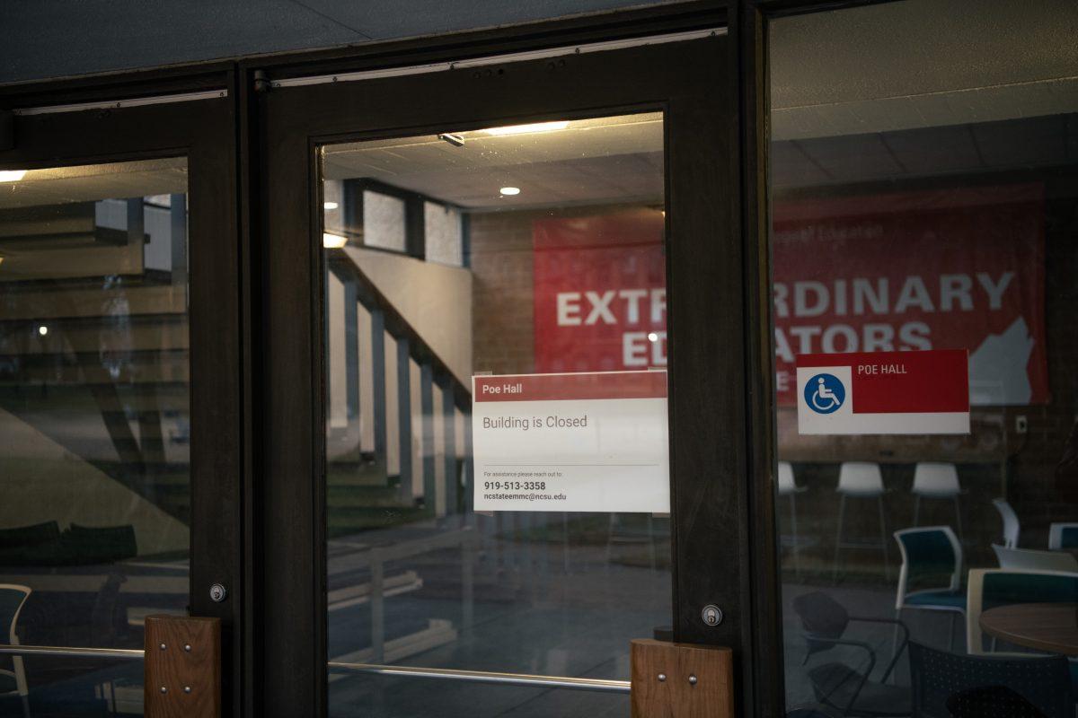 A sign on the doors marks the continued closure of Poe Hall on Wednesday, Jan. 24, 2024. Poe Hall was closed in November 2023 due to the presence of environmental contaminants (PCBs).