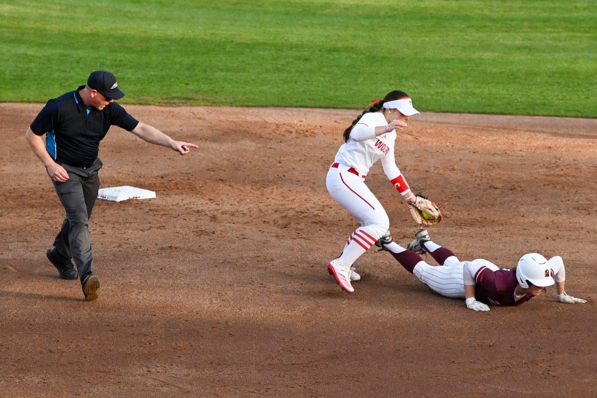 Freshman infielder Kendall Simmers reaches out to tag an opponent out during the game against Virginia Tech at Dail Softball Stadium on Friday, April 5, 2025. Simmers hit a homreun. NC State lost the game 10-2.