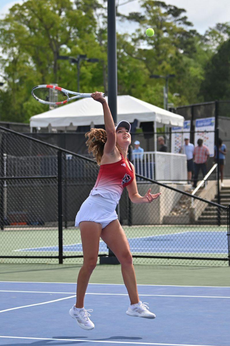 Sophomore Jasmine Conway leaps for a high ball during the ACC semifinals match against UNC-Chapel Hill at Cary Tennis Park on Saturday, April 19, 2025. The Wolfpack fell to the Tar Heels 4-1.&#160;
