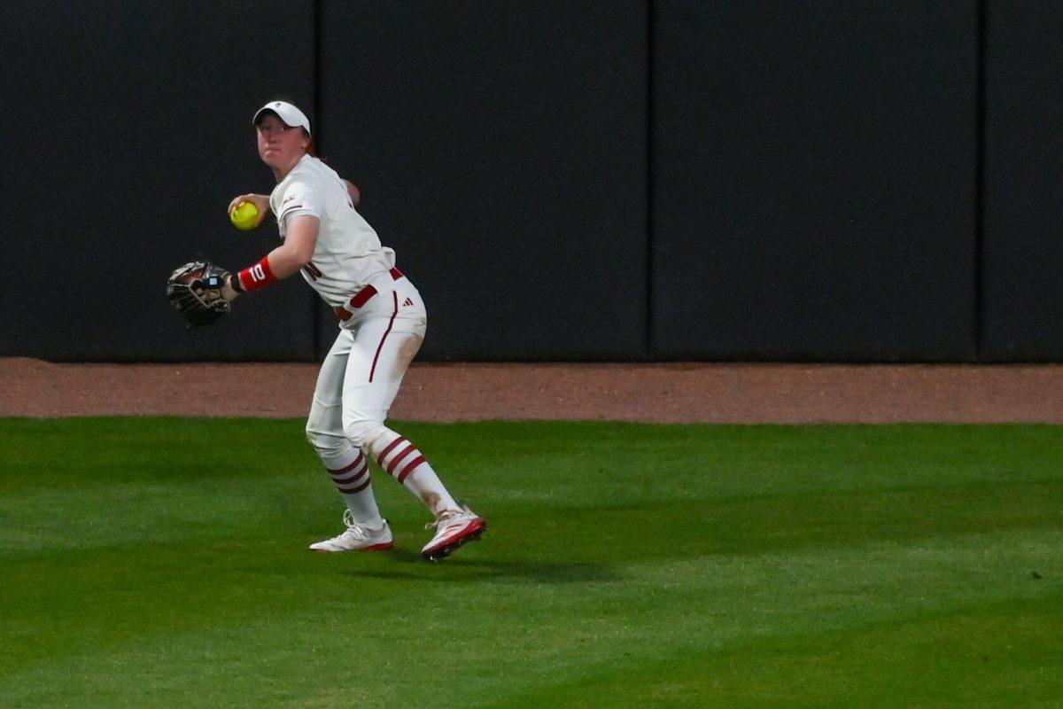 Junior outfielder Ellie Goins prepares to throw the ball during the game against Virginia Tech at Dail Softball Stadium on Friday, April 5, 2025. Goins walked her one time at bat. The Wolfpack lost to the Hokies 10-2.