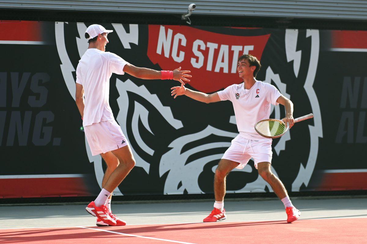 Redshirt freshman William Manning and senior Braden Shick celebrate after winning their doubles match versus Boston College at J.W. Isenhour Tennis Center on Friday, April 4, 2025. Manning and Shick won their doubles match 6-4. The Wolfpack beat the Eagles 4-0.