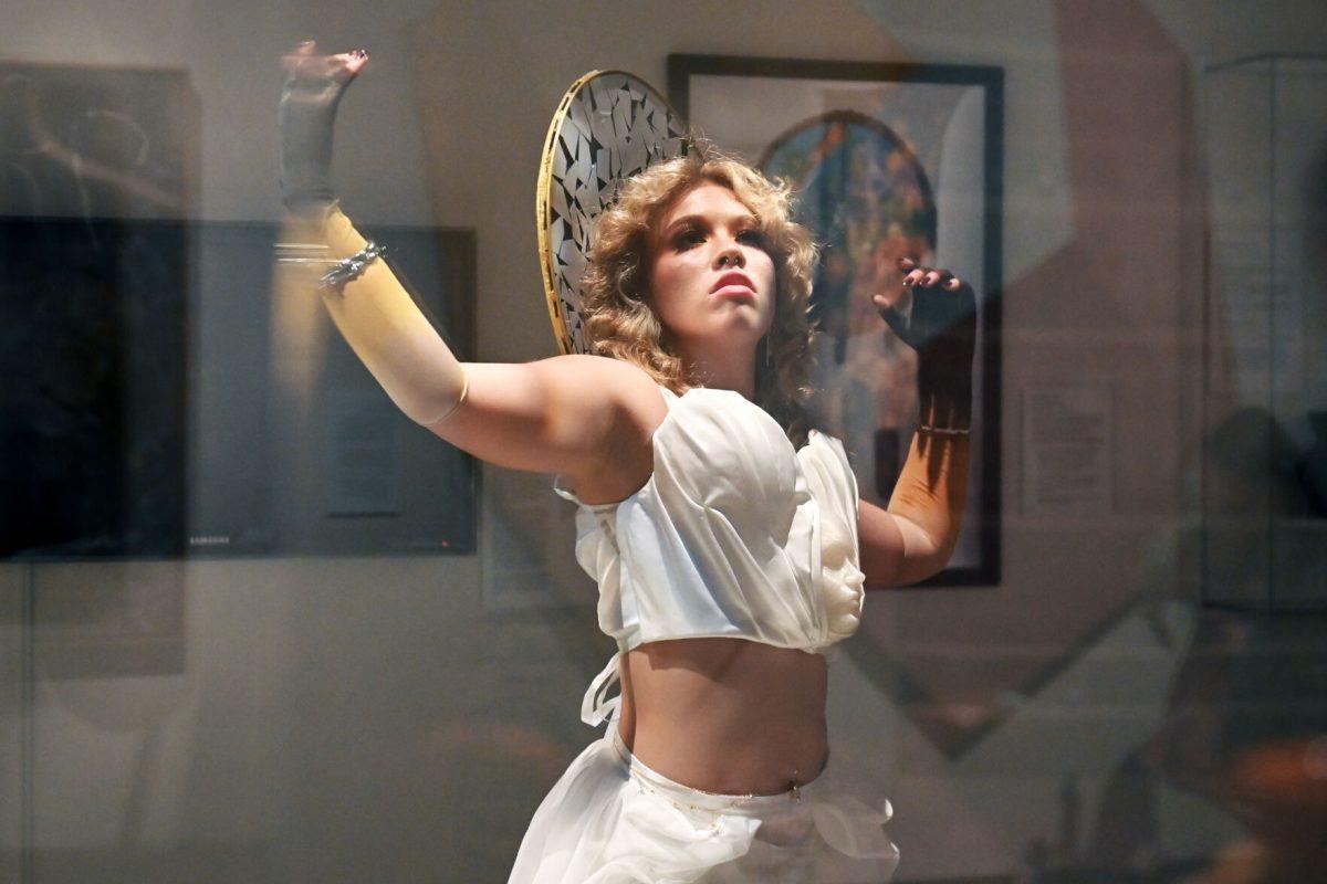 Alli Jo LaFevers, a third-year studying fashion and textile design, looks up while modeling &#8220;The Fall Of Icarus&#8221; designed by Mia Potter and Devyn Williams during the Art2Wear: Revive! show at the Gregg Museum of Art and Design. Potter and Williams&#8217; designs were inspired by ancient Greco-Roman art and clothing, as well as medieval garment construction, ballet, and masquerade.