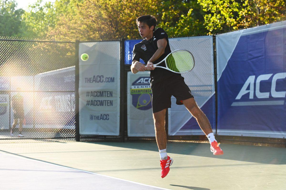 Senior Braden Shick returns the ball while warming up before the match versus Duke during the ACC Championship Quarterfinals at the Cary Tennis Park on Friday, April 18, 2025. Shick won his singles match 2-1 (1-6, 7-5, 6-3). The Wolfpack lost 4-3 to the Blue Devils.