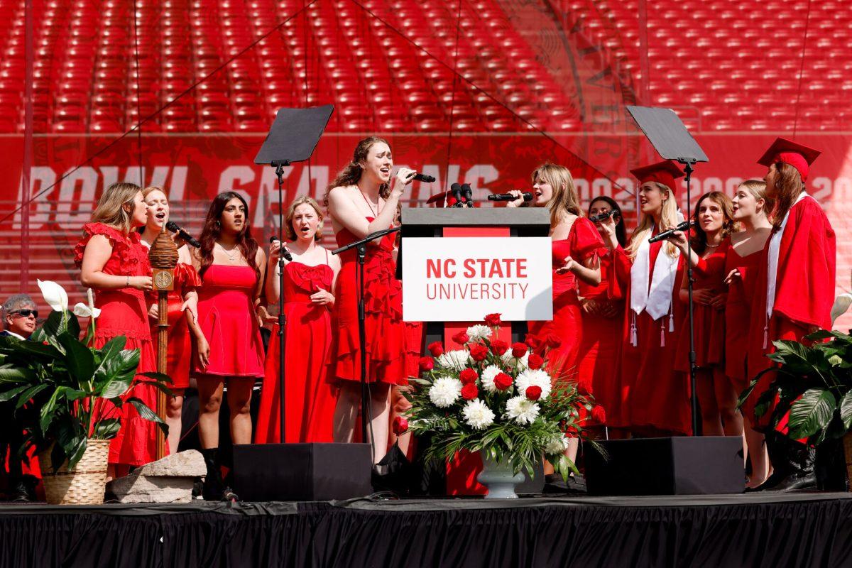 The Ladies in Red sing the alma matter during the University Commencement ceremony in Carter-Finley Stadium on Saturday, May 3, 2025. Over 5,079 students graduated with Bachelor's degrees at NC States 2025 Spring Commencement Ceremony.