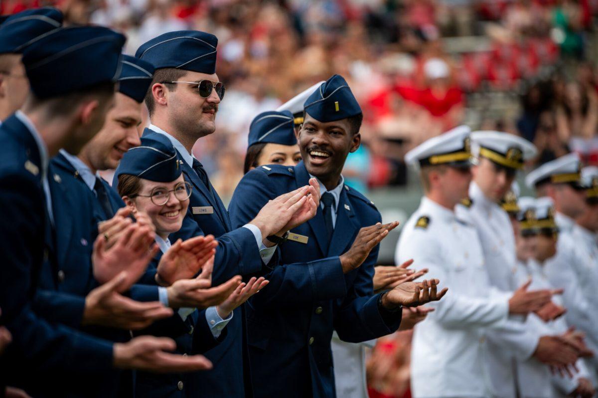 Air force and naval cadets applaud each other after being recognized during the University Commencement ceremony in Carter-Finley Stadium on Saturday, May 3, 2025. NC State conferred 7,234 degrees at the ceremony, including 5,079 bachelor&#8217;s, 1,783 master&#8217;s, 306 doctoral, and 66 associate degrees.