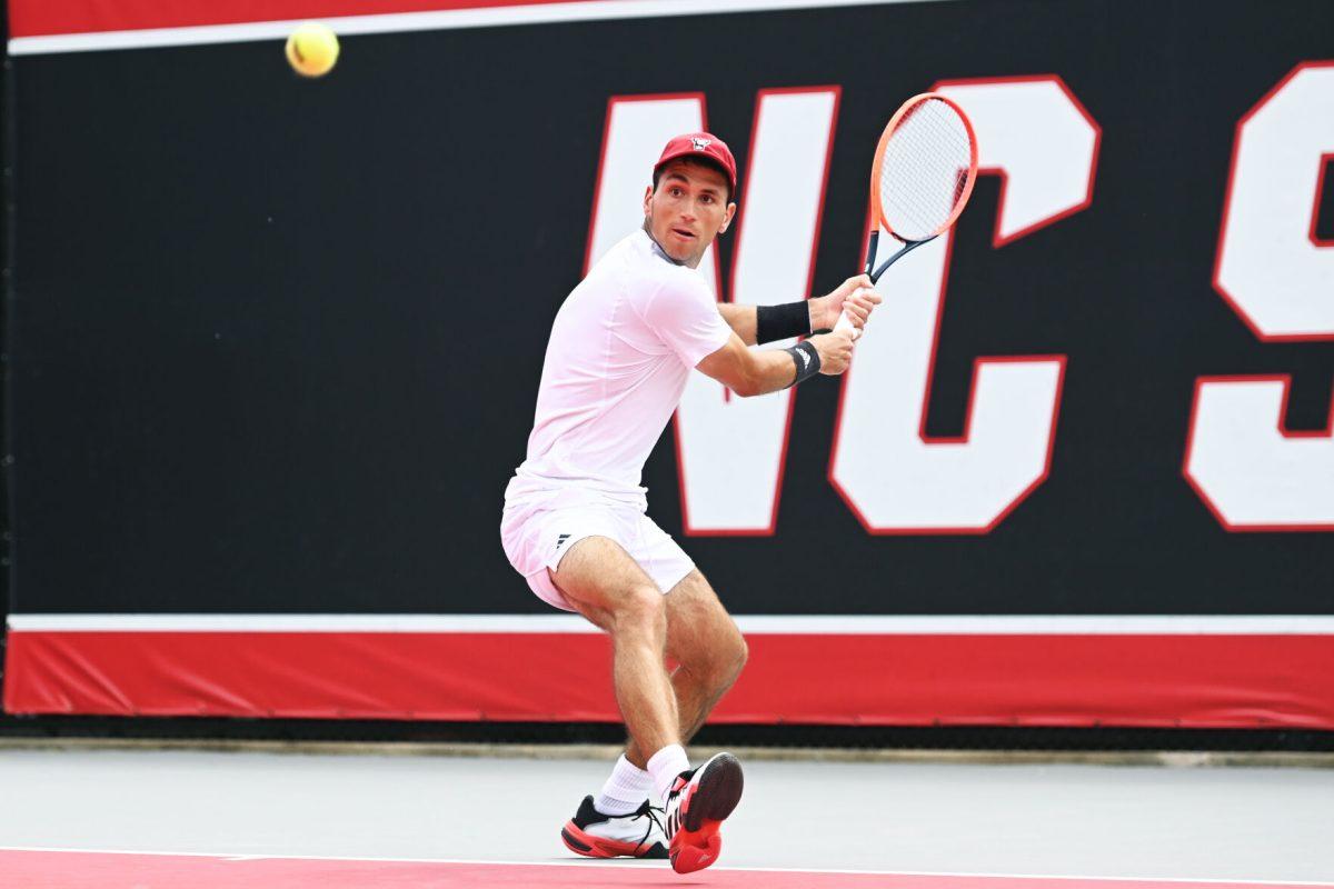 Senior Luca Staeheli watches the ball during the NCAA first round match versus South Carolina State at J.W. Isenhour Tennis Center on Saturday, May 3, 2025. Staeheli won his singles match 2-0 (6-1, 6-1). The Wolfpack beat the Bulldogs 4-0.