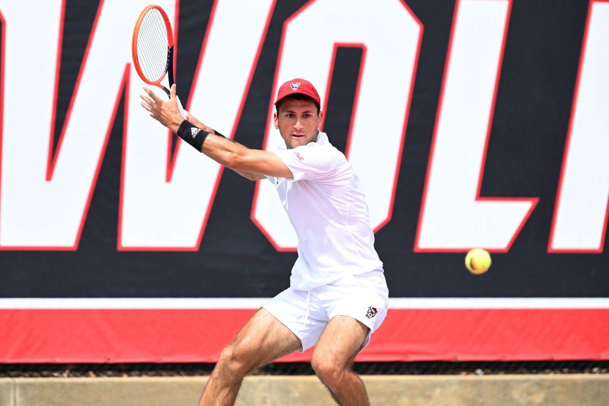 Senior Luca Staeheli prepares to return the ball during the NCAA first round match versus South Carolina State at J.W. Isenhour Tennis Center on Saturday, May 3, 2025. Staeheli won his singles match 2-0 (6-1, 6-1). The Wolfpack beat the Bulldogs 4-0.