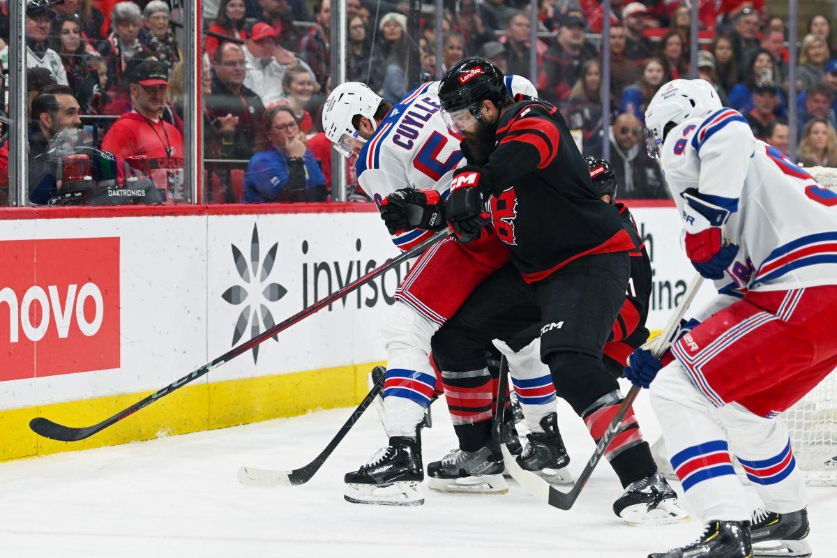 Defenseman Brent Burns battles an opponent for the puck during the game versus the New York Rangers at the Lenovo Center on Saturday, April 12, 2025. The Hurricanes beat the Rangers 7-3.