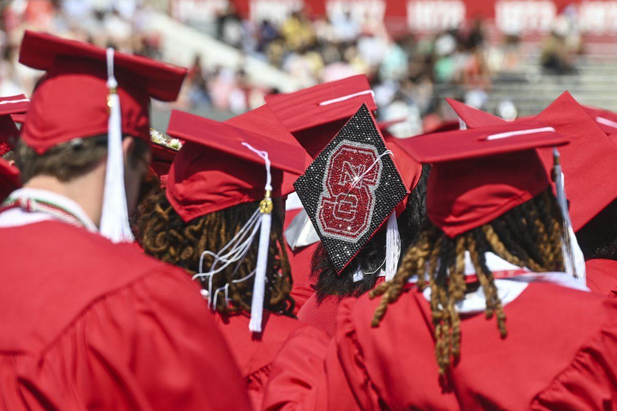 Students sit and listen during the Spring Commencement Ceremony in the Carter-Finley Stadium on Saturday, May 3, 2025. The class of 2025 had more than 6,800 graduates receiving 7,234 degrees.