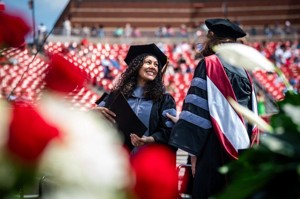 Sonyaliz Gaveo, a veterinary school graduate, smiles at Dean Kathryn Meurs after receiving her degree on stage during the University Commencement ceremony in Carter-Finley Stadium on Saturday, May 3, 2025. Over 6,800 students turned their tassels at NC State's 2025 spring commencement ceremony.