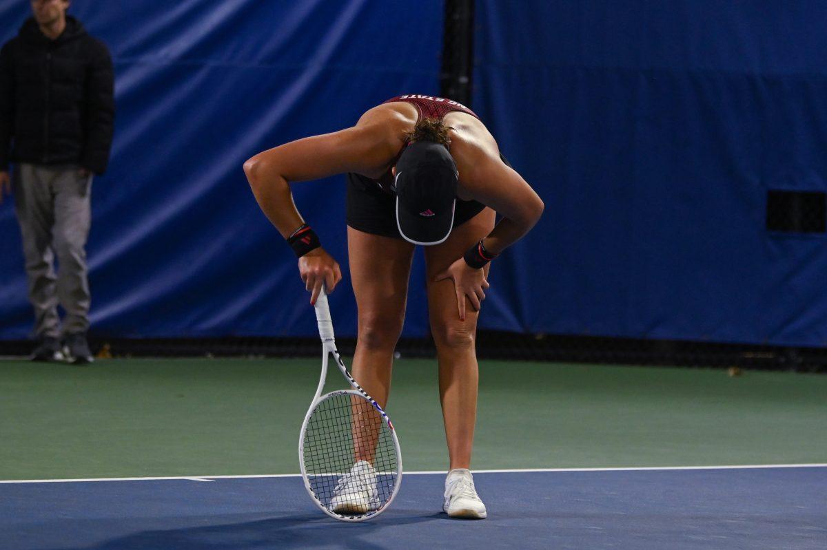 Freshman Mia Slama slumps after the loss of her singles match against Duke at Ambler Tennis Stadium on Friday, March 21, 2025. NC State fell to Duke 3-4.
