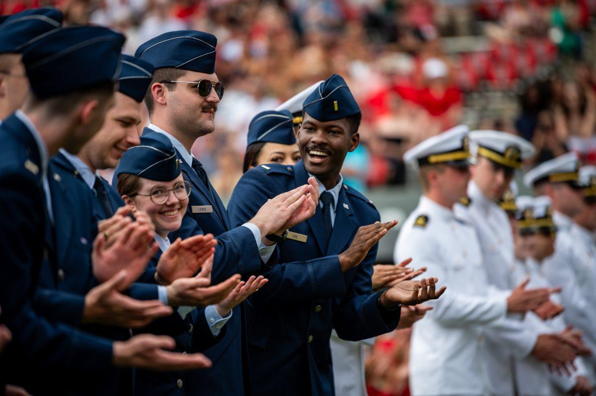 Air force and naval cadets applaud each other after being recognized during the University Commencement ceremony in Carter-Finley Stadium on Saturday, May 3, 2025. NC State conferred 7,234 degrees at the ceremony, including 5,079 bachelor&#8217;s, 1,783 master&#8217;s, 306 doctoral, and 66 associate degrees.